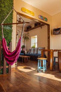 a room with a hammock in a living room at Samesun Venice Beach Hotel & Hostel in Los Angeles