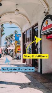 a building with a sign that reads shop and chill here at Samesun Venice Beach Hotel & Hostel in Los Angeles