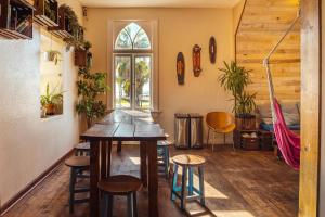 a room with a table and chairs and a window at Samesun Venice Beach Hotel & Hostel in Los Angeles +30 photos