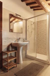 a bathroom with a sink and a shower at Residenza Antica Canonica in Città di Castello +53 photos