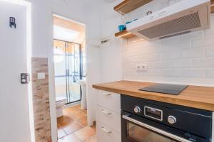 a kitchen with a counter top and a sink at GuestReady - Calvario Rota 30 JC in Rota +18 photos