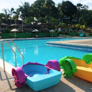 a pool with a toy car and a raft at RR Family Spring Resort in Maramag