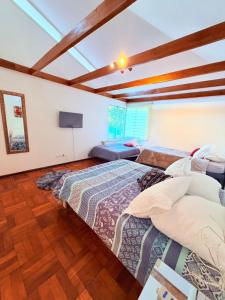 a bedroom with two beds in a room at Casa Las Condes, steps from Manquehue Metro in Santiago