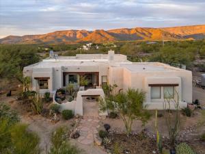 an aerial view of a house in the desert at Desert Oasis Pool, Golf, Games Mountain Views in New River
