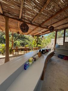 a large long white counter in a building at La baxada mazunte in Mazunte