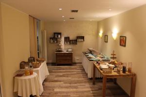 a large room with tables with food on them at Hotel Bitburger Hof in Bitburg
