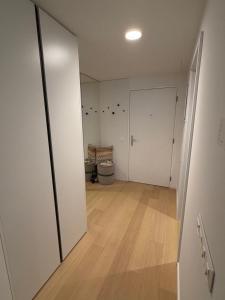 an empty room with a toilet and a door at Sky Park by MISSONI in Nivy