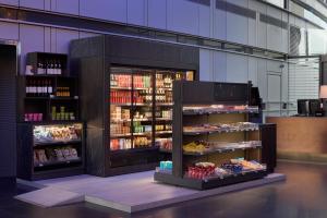 a store with a display of food and drinks at Radisson Blu Hotel, London Canary Wharf East in London