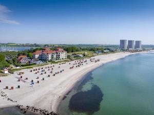 an aerial view of a beach with umbrellas at Strandburg "Tiefblau" 01 b in Burgtiefe auf Fehmarn  +10 photos