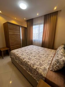 a bedroom with a bed and a window at Serenity Residence lux1plus1 in Alanya +20 photos