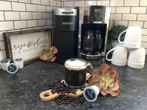 a cup of coffee sitting on top of a counter at Comfortable Craftsman Getaway in Lancaster