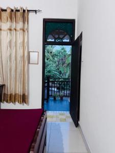 an open door to a room with a window at Nathalie Villa in Anuradhapura