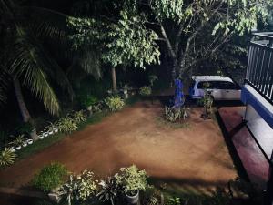 an aerial view of a yard with a white van at Nathalie Villa in Anuradhapura