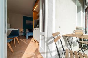 a kitchen and dining room with a table and chairs at Azure Comfort Studio in Bellagio +13 photos