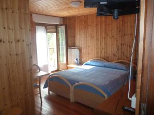 Postel nebo postele na pokoji v ubytování Hotel Fior di Roccia