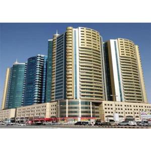 a group of tall buildings in a city at Canel View Holiday Home with Parking in Ajman 