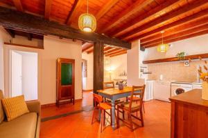 a kitchen and living room with a table and chairs at Beach Lake Apartment in Bellagio +23 photos