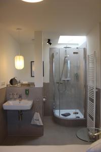 a bathroom with a shower and a sink at Schwanenhof Hotel und Restaurant in Erkelenz +30 photos