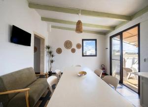a living room with a table and a couch at Fronte Mare in Centro a Torre Lapillo in Torre Lapillo