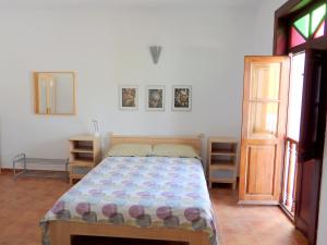 Ένα ή περισσότερα κρεβάτια σε δωμάτιο στο Casa Nieves de Igueste