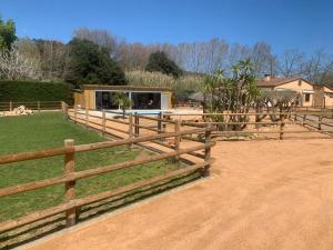 a wooden fence in front of a house at Rancho Catalan 2 in Castillo de Aro
