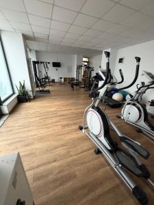a gym with several exercise bikes in a room at Resident aparments two bed with balcony in Bucharest