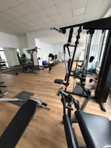 a gym with several treadmills and exercise bikes at Resident aparments two bed with balcony in Bucharest