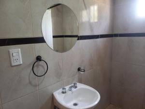 a bathroom with a sink and a mirror at Tunquelen II in Colorado River