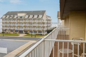a balcony view of a hotel with a building at Boardwalk One- Studio w Balcony and Partial Ocean View in Ocean City