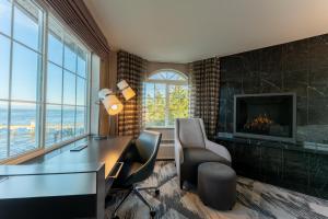 an office with a desk and chairs and a fireplace at Silver Cloud Hotel - Mukilteo Waterfront in Mukilteo