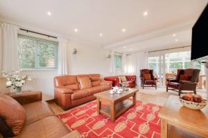 a living room with a couch and a table at 5 Bed in Croyde oc-brambc in Croyde