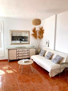 a living room with a couch and a table at Ocean Breeze & View Médano in El Médano