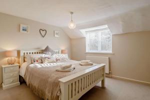 a bedroom with a bed with two towels on it at 4 Bed in Westleton oc-s27303 in Westleton