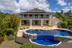an image of a house with a swimming pool at Sugar Hill Resort, Bananaquit in Saint Joseph