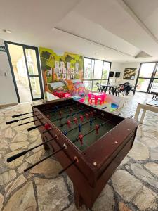 a pool table in a room with a play area at Xingó Parque Hotel in Canindé de São Francisco