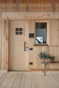 a wooden garage door with a sign on it at Agriturismo La Daga Nature Lodge in Auronzo di Cadore +66 photos