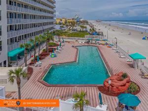 an overhead view of a swimming pool and the beach at Amazing Studio Steps Away From The Atlantic Ocean! in Daytona Beach