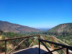 a view of the mountains from a wooden bridge at Terraza Olmué Piscina y Tinaja Uso Exclusivo in Olmué +29 photos