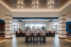 a large dining room with a large table and chairs at Hotel Eastport in The Villages +38 photos