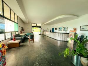 a living room with a couch and a table at Xingó Parque Hotel in Canindé de São Francisco +100 photos