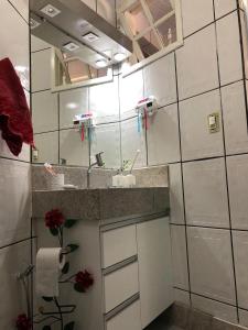 a bathroom with a sink and a mirror at Castelo Princesa Isabel in Ouro Preto +13 photos