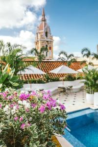 a view of a building with a pool and flowers at Amarla Boutique Hotel Cartagena in Cartagena de Indias +46 photos