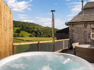 a jacuzzi tub on a balcony with a view at 3 Bed in Barden oc-s33752 in Sabden