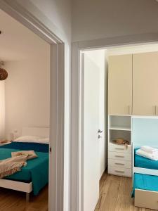 a bedroom with a bed and a mirror at Ca' dei Venti in Chioggia
