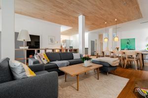 a living room with a couch and a table at Antonius Art-Loft in Waldshut-Tiengen