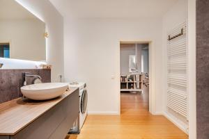a bathroom with a bowl sink on a counter at Antonius Art-Loft in Waldshut-Tiengen +42 photos