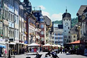 a city street with a clock tower in a town at Antonius Art-Loft in Waldshut-Tiengen