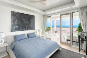 a bedroom with a bed and a balcony with the ocean at Villa Kohia, stunning sea views, breakfast, serviced daily, private dining service on request, North Chaweng in Nathon Bay +116 photos