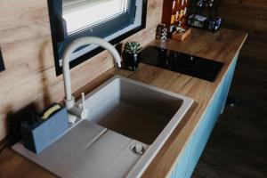 a sink in a tiny kitchen with a window at Villa Šašava in Bosanska Gradiška +52 photos