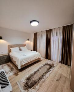 a bedroom with a bed and a large window at Luxury Villa Bar in Bar +51 photos